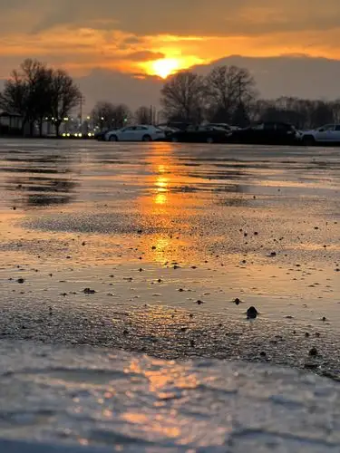 Sunset fire on a freezing canvas.